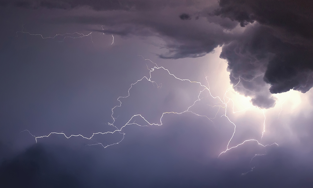 lightning across the sky during a thunderstorm