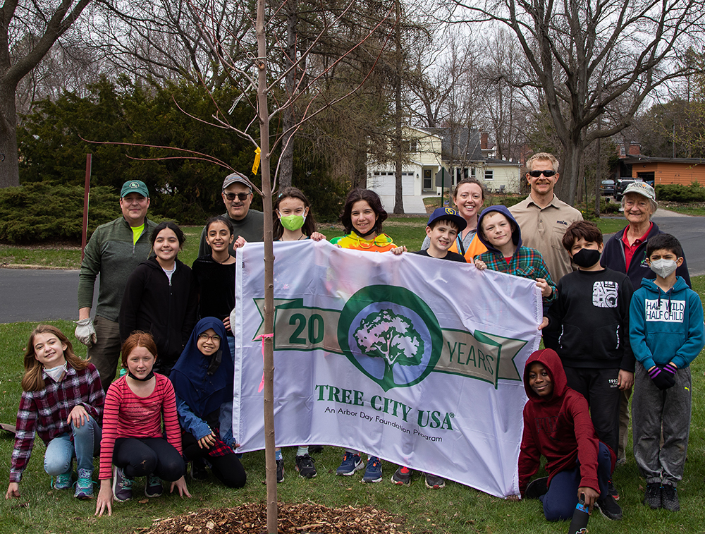 Students and MGE employees after planting a tree for Arbor Day