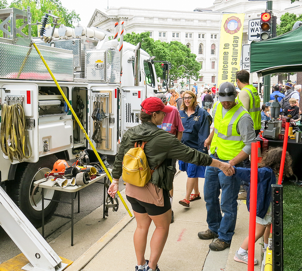 Community members explore MGE equipment at the annual Safety Saturday event