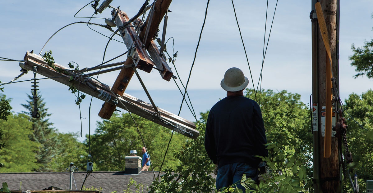 worker and downed power line