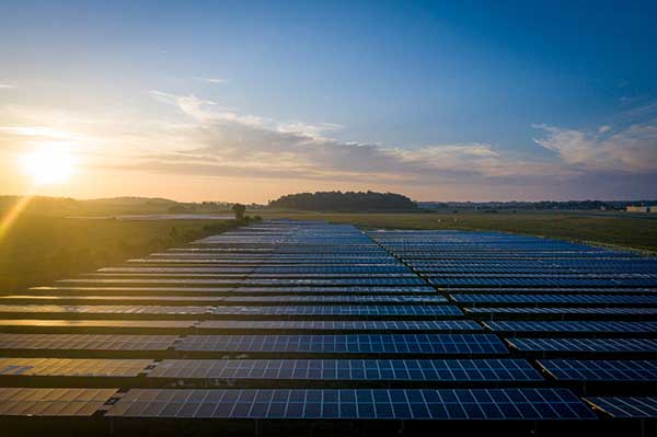 Sunrise over 5-megawatt Morey Field Solar Farm, home of Shared Solar, under construction in Middleton, Wis.