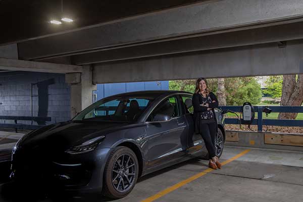 WPS employee Daphne Dollak charges her electric vehicle (EV) while at work. The new EV charger is part of the company’s efforts to increase its sustainable practices.