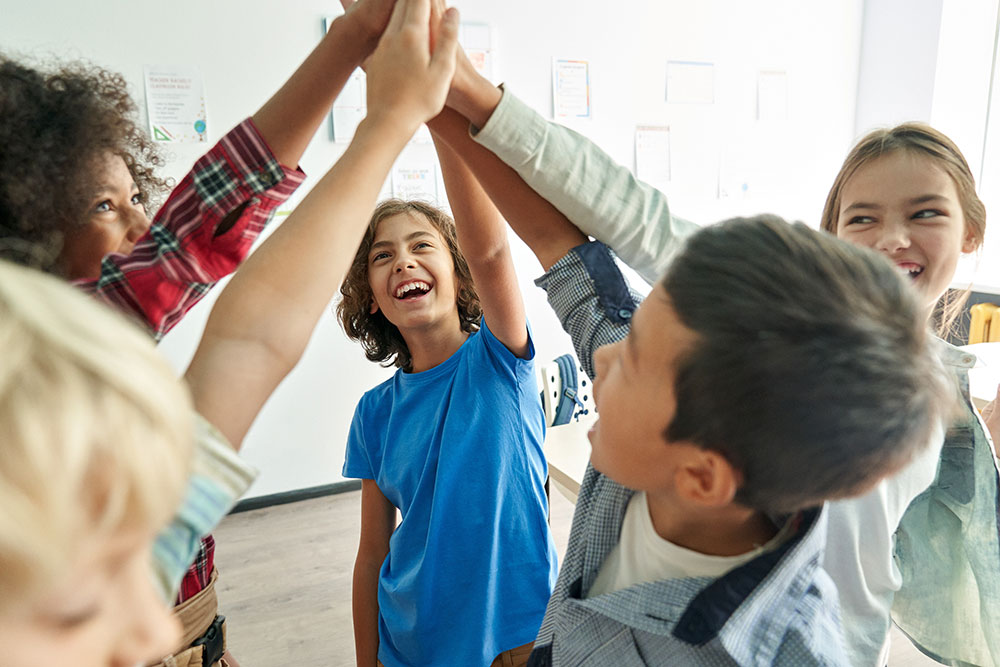 Students giving each other high fives