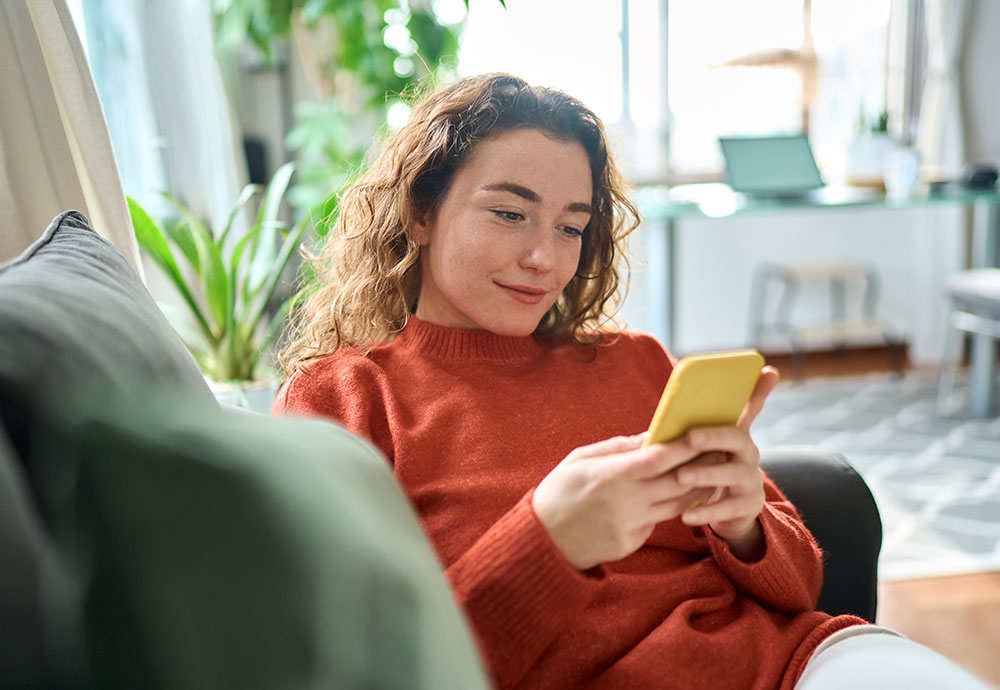 Woman using phone to log in to My Account