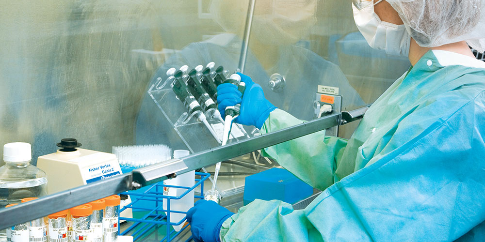 technologist performing collecting samples in a lab
