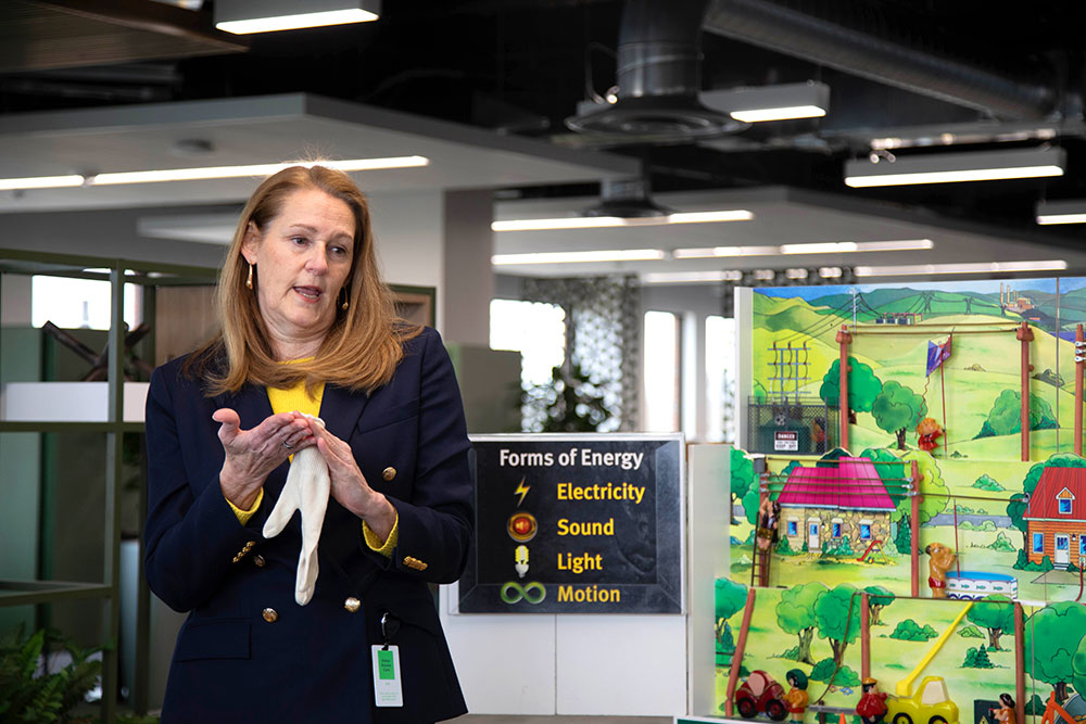 Flossie Baryenbruch, a former teacher and MGE’s electric safety consultant, with Hazard Hamlet