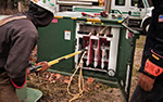 Employee accessing a transformer