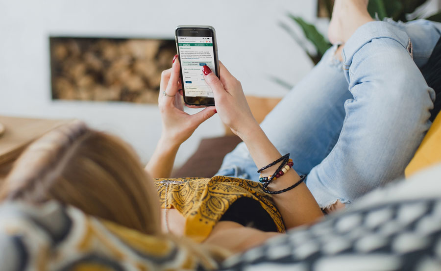 Woman using My Account on her mobile phone.